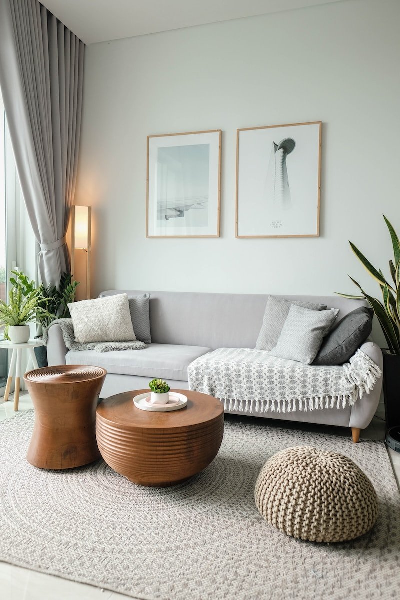 Photo by Minh Pham a living room filled with furniture and a large window